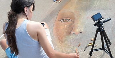 Young woman working on chalk art