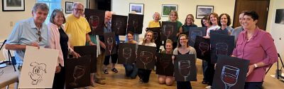paint and sip class showing their paintings